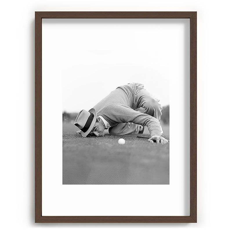 Eye to the ground on the 18th hole; golfing man eyes ball to measure distance to hole vintage black and white portrait photograph - photography - photographs poster Framed Art Print Gallery Image 91