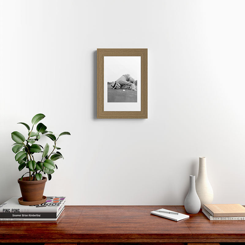 Eye to the ground on the 18th hole; golfing man eyes ball to measure distance to hole vintage black and white portrait photograph - photography - photographs poster Framed Art Print Gallery Image 52