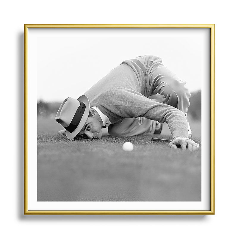 Eye to the ground on the 18th hole; golfing man eyes ball to measure distance to hole vintage black and white portrait photograph - photography - photographs poster Framed Art Print Gallery Image 133