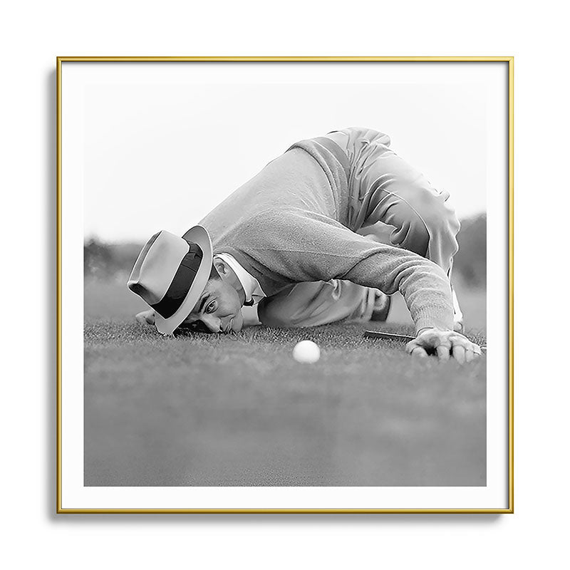 Eye to the ground on the 18th hole; golfing man eyes ball to measure distance to hole vintage black and white portrait photograph - photography - photographs poster Framed Art Print Gallery Image 136