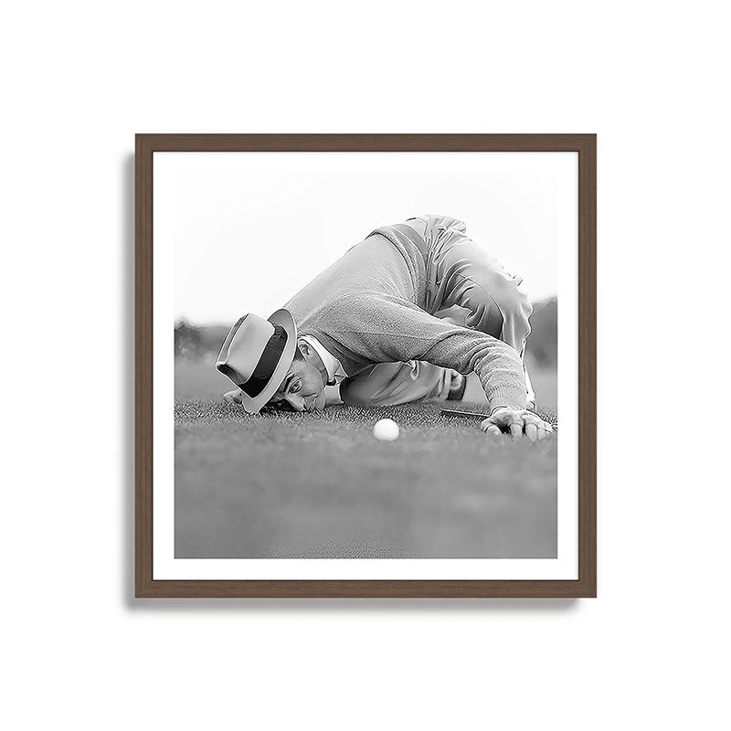 Eye to the ground on the 18th hole; golfing man eyes ball to measure distance to hole vintage black and white portrait photograph - photography - photographs poster Framed Art Print Gallery Image 17