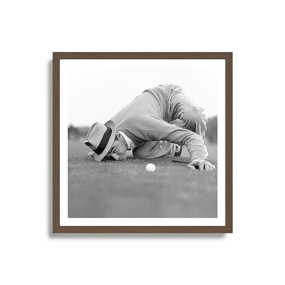 Eye to the ground on the 18th hole; golfing man eyes ball to measure distance to hole vintage black and white portrait photograph - photography - photographs poster Framed Art Print Gallery Image 17