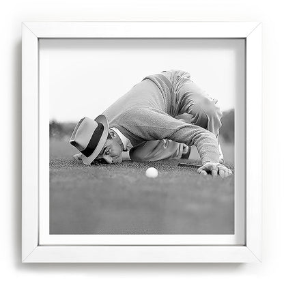 Eye to the ground on the 18th hole; golfing man eyes ball to measure distance to hole vintage black and white portrait photograph - photography - photographs poster Framed Art Print Gallery Image 114