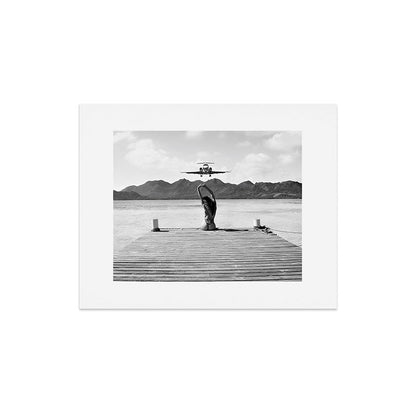 Steady as she goes girl in bikini on a dock with plane landing black and white photograph Art Print Gallery Image 7